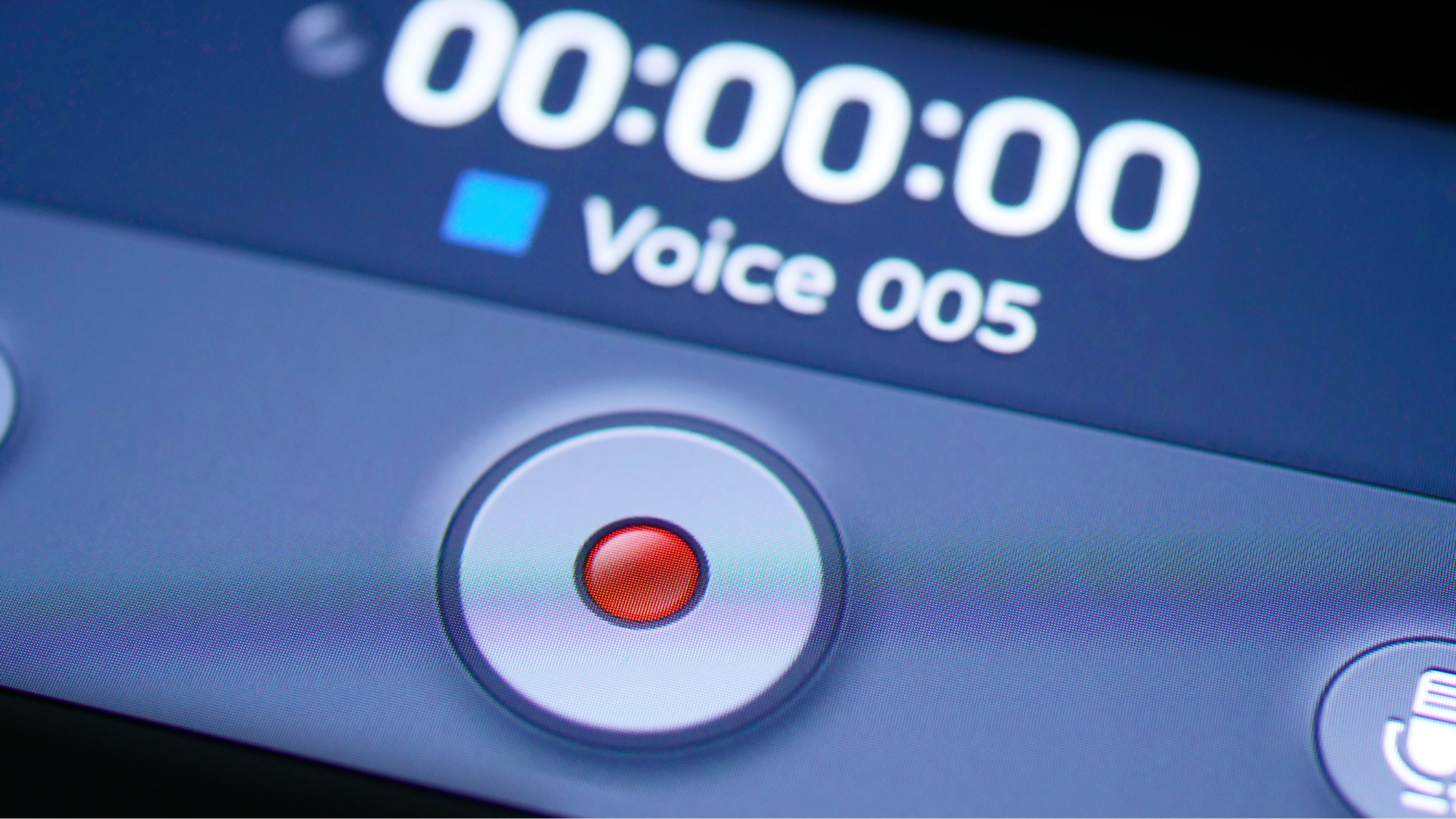 Close-up of a digital interface showing a red record button and the text "Voice 005" on screen, clearly indicating an active Teams phone recording or the process of recording a Microsoft Teams call.